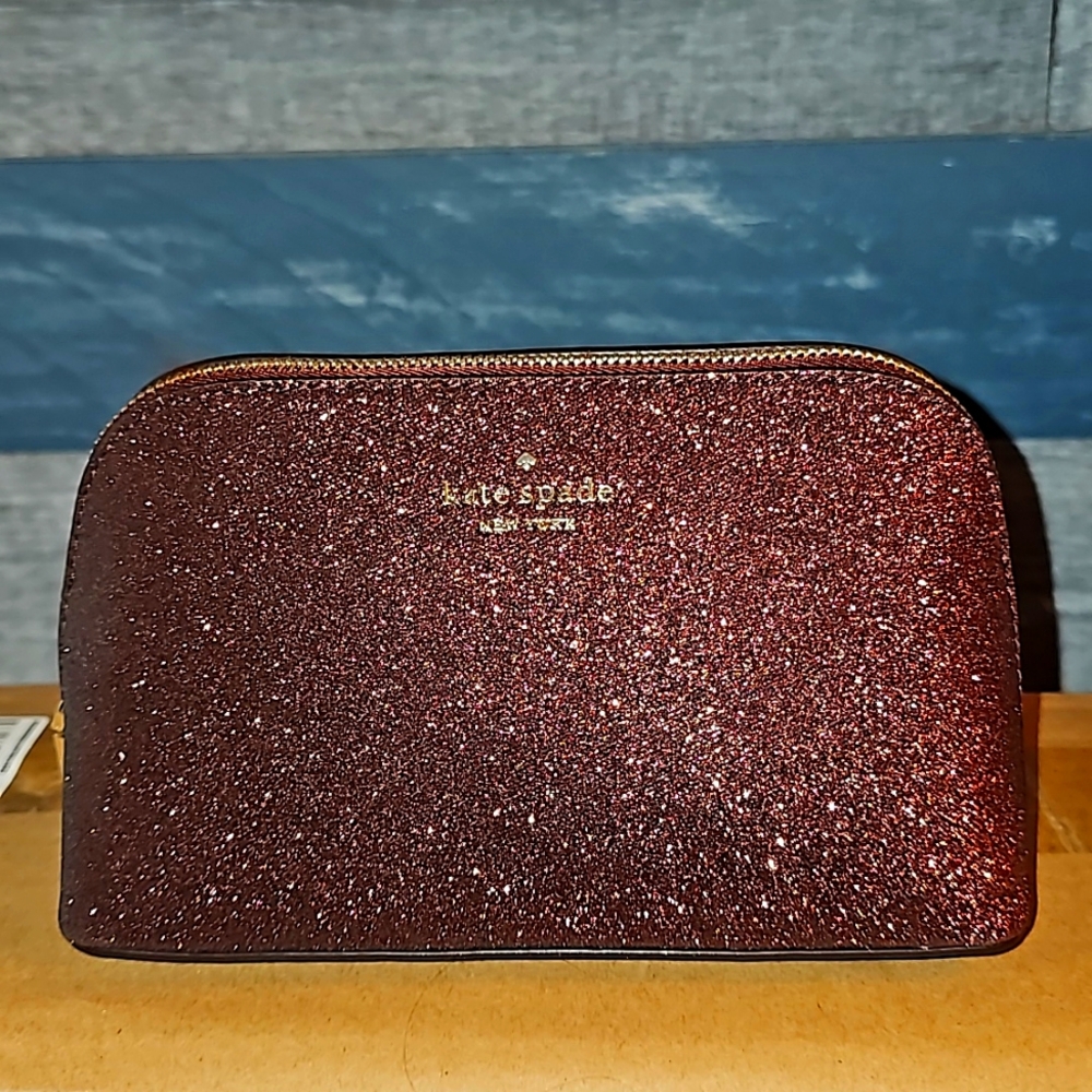 Kate Spade New York Shimmy Tinsel Glitter Cosmetic Case in maroon (deep nova).